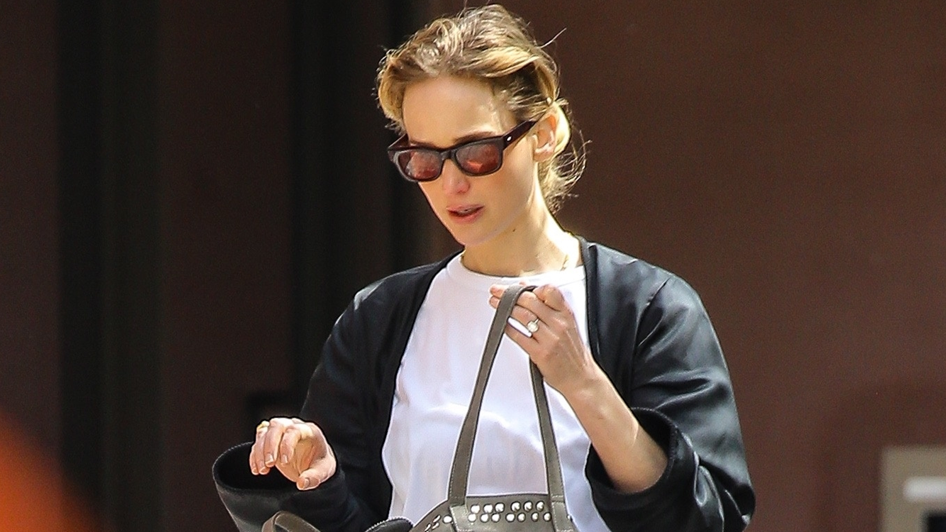 Jennifer Lawrence traded the flip-flop trend for striped Adidas sandals in NYC
