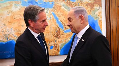 U.S. Secretary of State Antony Blinken shakes hands with Israeli Prime Minister Benjamin Netanyahu