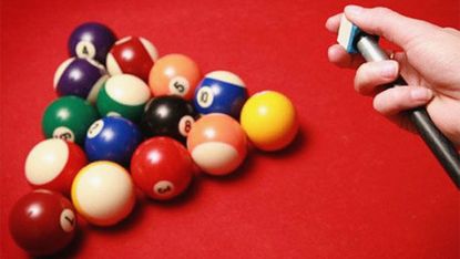 billiard balls and pool stick