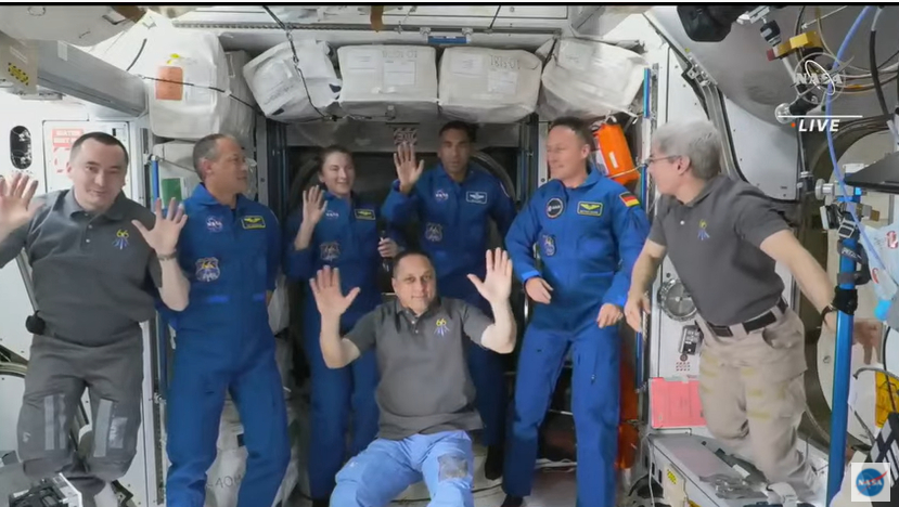 The newly combined seven-person crew made up of the core Expedition 66 crew and SpaceX's Crew-3 astronauts wave after a welcome ceremony on the International Space Station on Nov. 11, 2021.