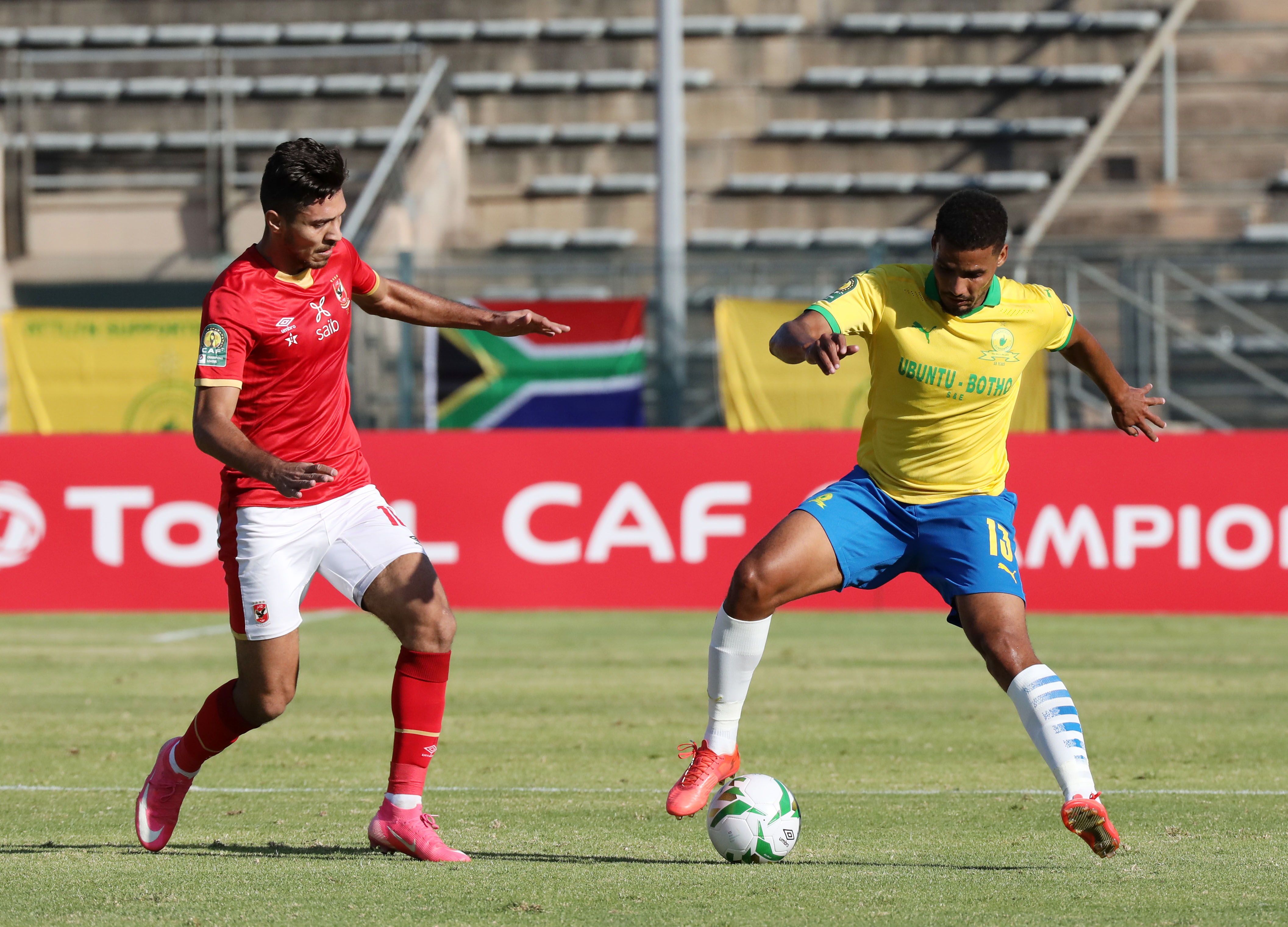 Rivaldo Coetzee of Mamelodi Sundowns challenged by Mohamed Sherif of Al Ahly