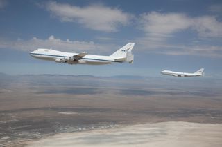 NASA's modified Boeing 747 Shuttle Carrier Aircraft briefly flew in formation over the Edwards Air Force Base Test Range on Aug. 2, 2011.