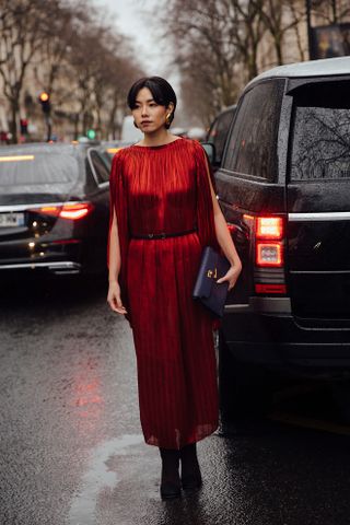 woman in high neck red dress