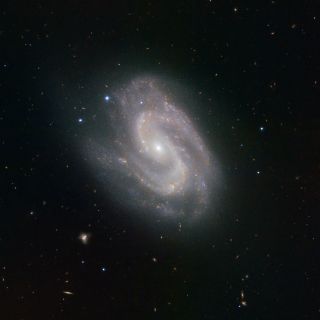 In this image of galaxy NGC 157, the spiral arms appear to form a giant