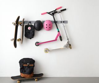 wall mounted rack for hanging scooters, helmets and skateboards