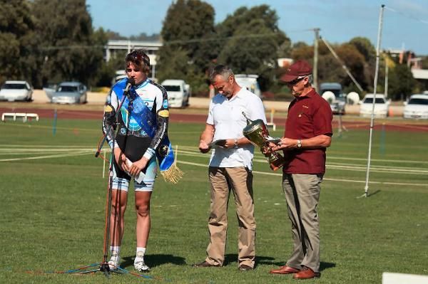 Jackson Law talks to the crowd after winning the men's wheel race.