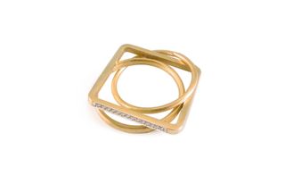 A gold square ring entwined with 2 circular gold rings.