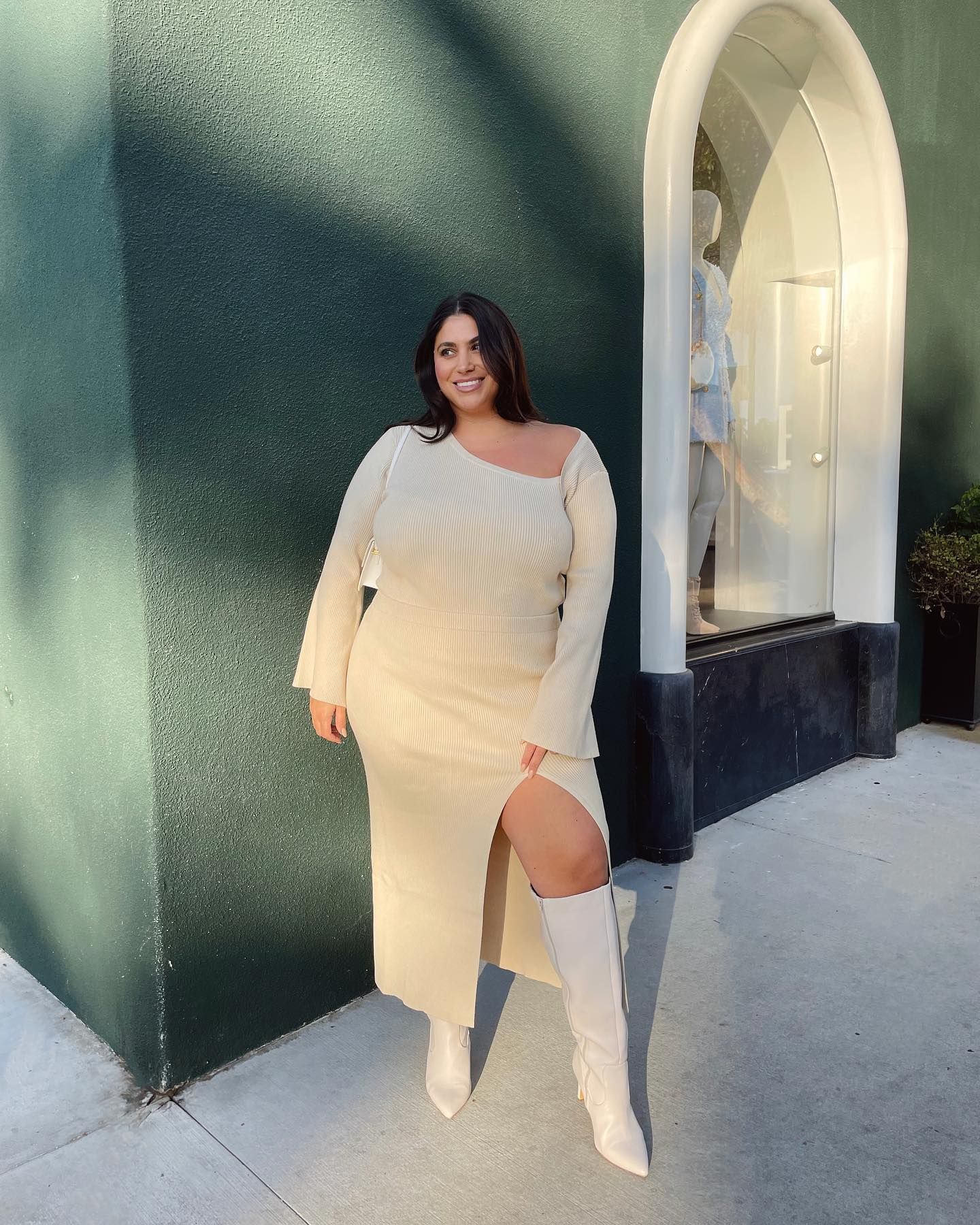 giasinatra wears a pale yellow dress white boots