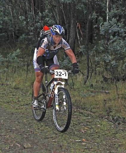 Elite Women 2010 World Solo 24Hr Champion, Jess Douglas, during a pit stop in the 2010 world champs during a 7 day stage race in the Australian bush (2011 Terra Australis)
