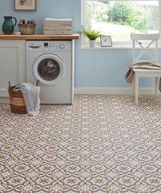 kitchen with washing machine and patterned vinyl flooring