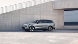 volvo ex90 in front of stone structure