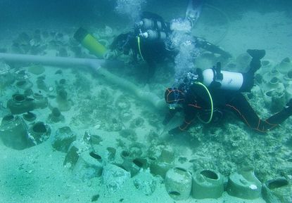 Archeologists discover treasures in ancient shipwreck. 