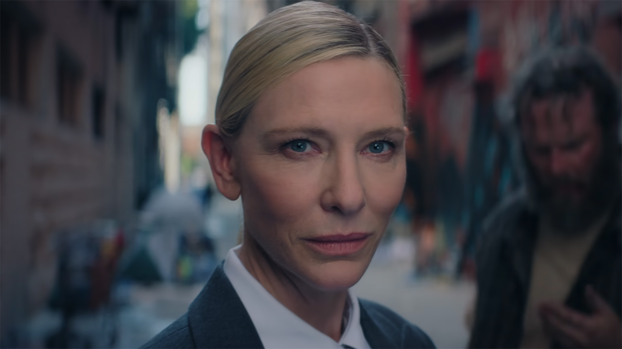 Cate Blanchett's Recruiter looking at an off-camera Front Man in Squid Game season 3