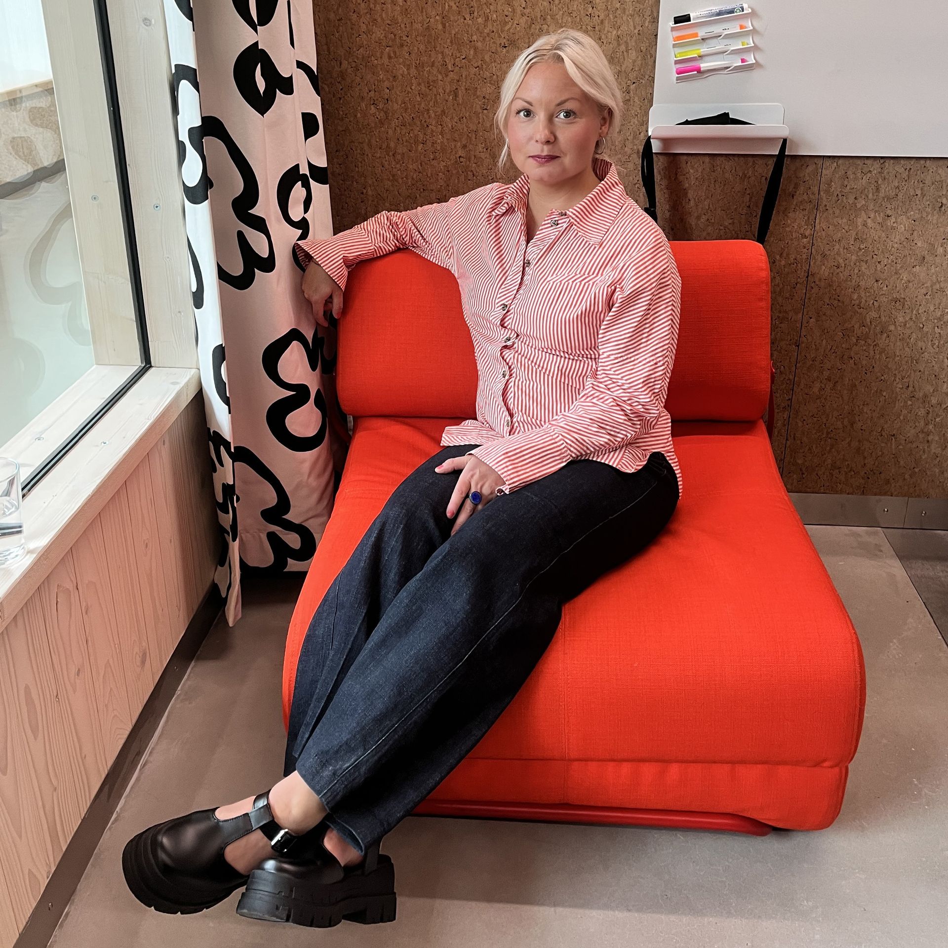 Designer Matilda Lindstam Nilsson sitting on the IKEA PS 2026 Skiftebo Chair Bed