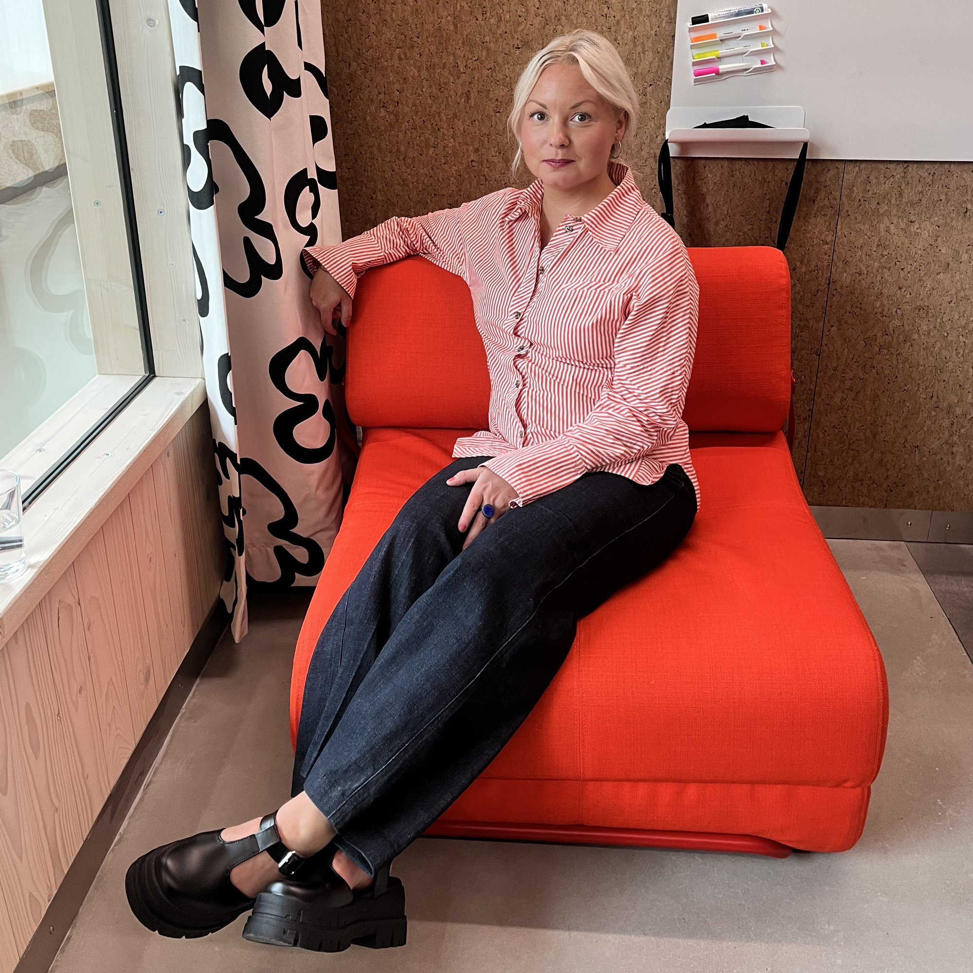 Designer Matilda Lindstam Nilsson sitting on the IKEA PS 2026 Skiftebo Chair Bed