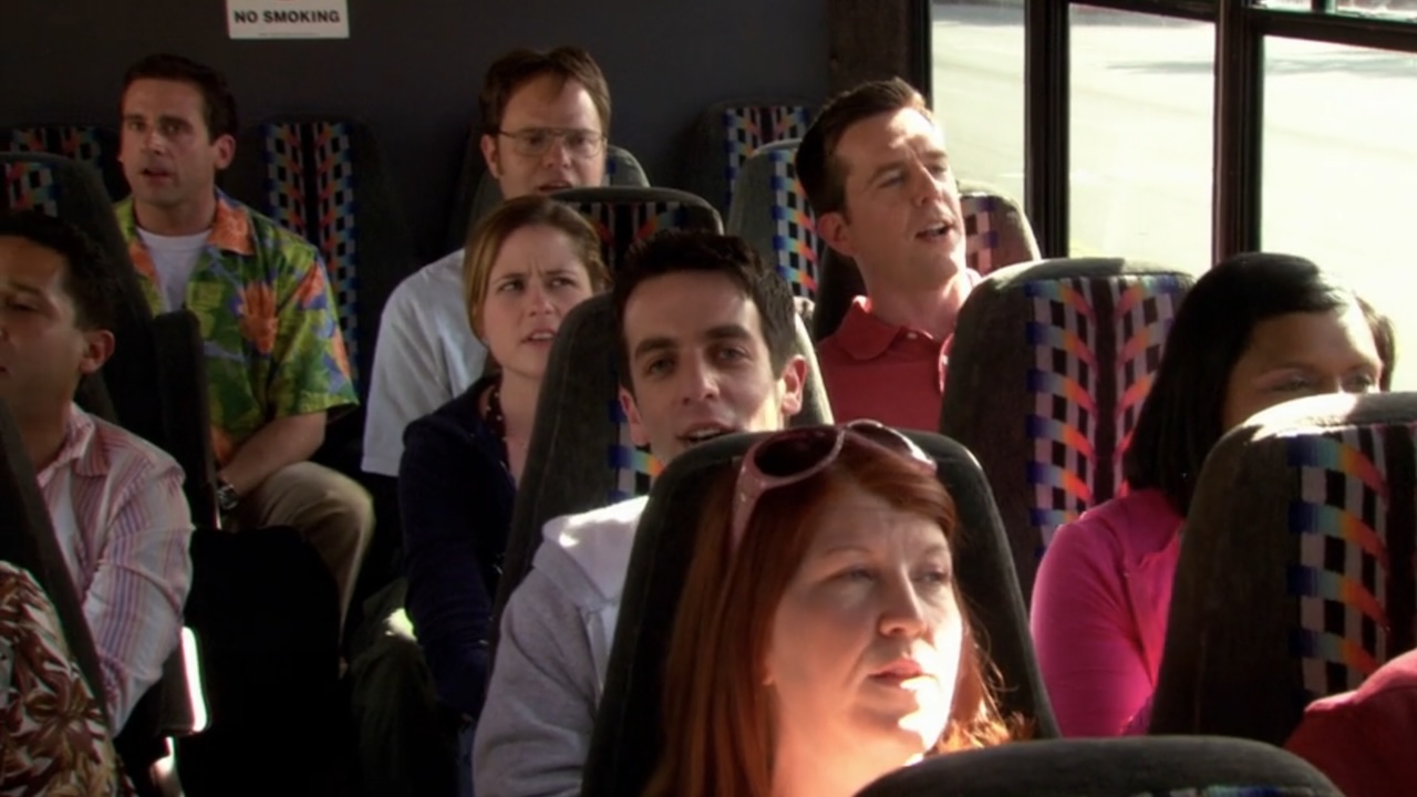The Office characters singing on a bus