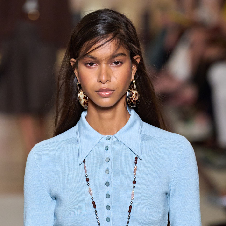 A model wearing a blue top