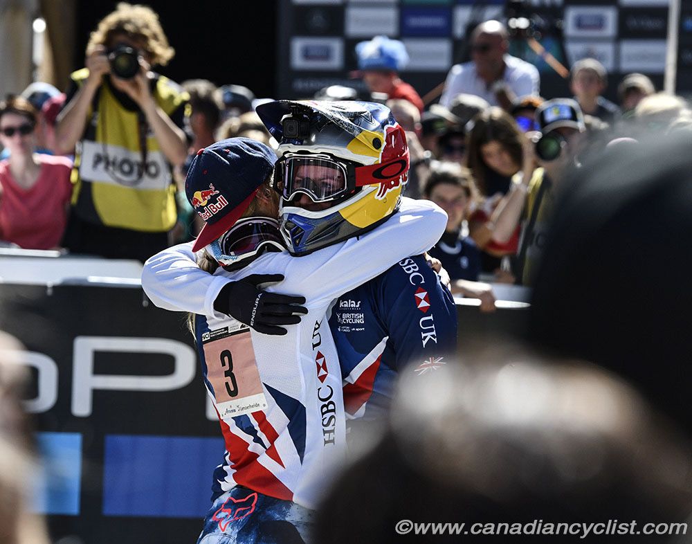 Rachel Atherton gets a congratulatory hug from British teammate Tahnee Seagrave