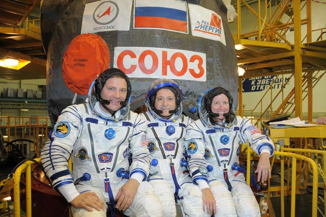 Picture of EXP 24 crew, 3 astronauts suited up