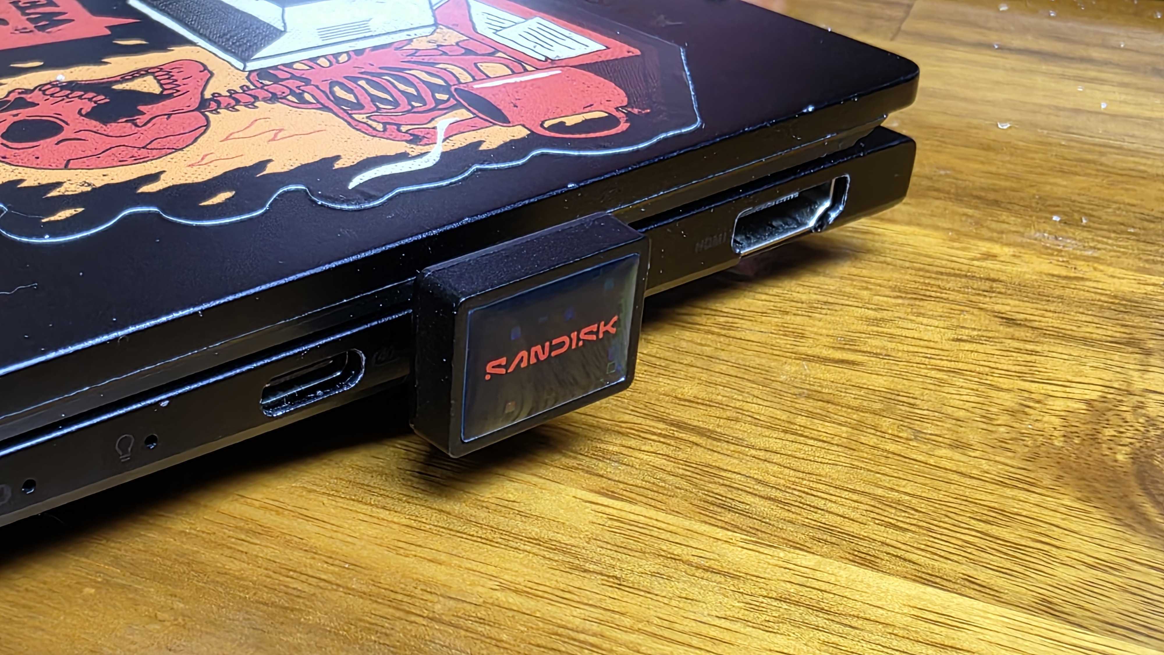 SanDisk Extreme Fit 1TB drive installed in a laptop,  nearly blocking the adjacent USB-C port