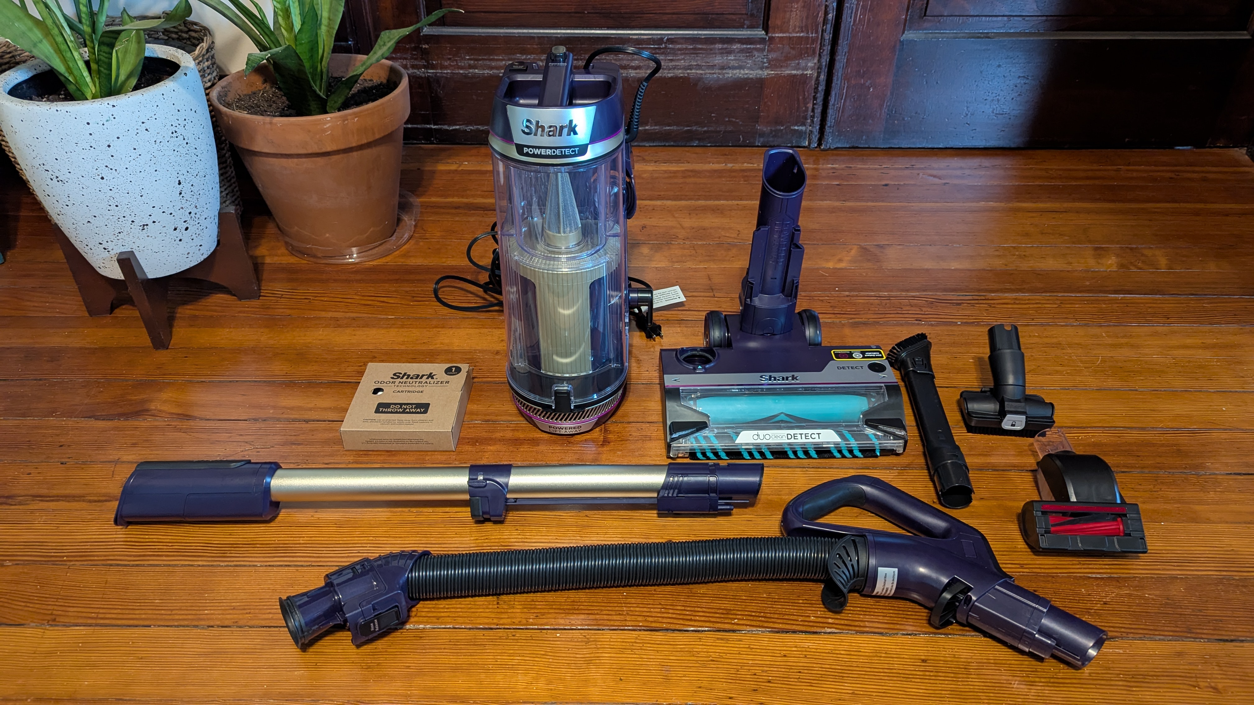 Shark PowerDetect Upright vacuum broken apart into all of its component parts