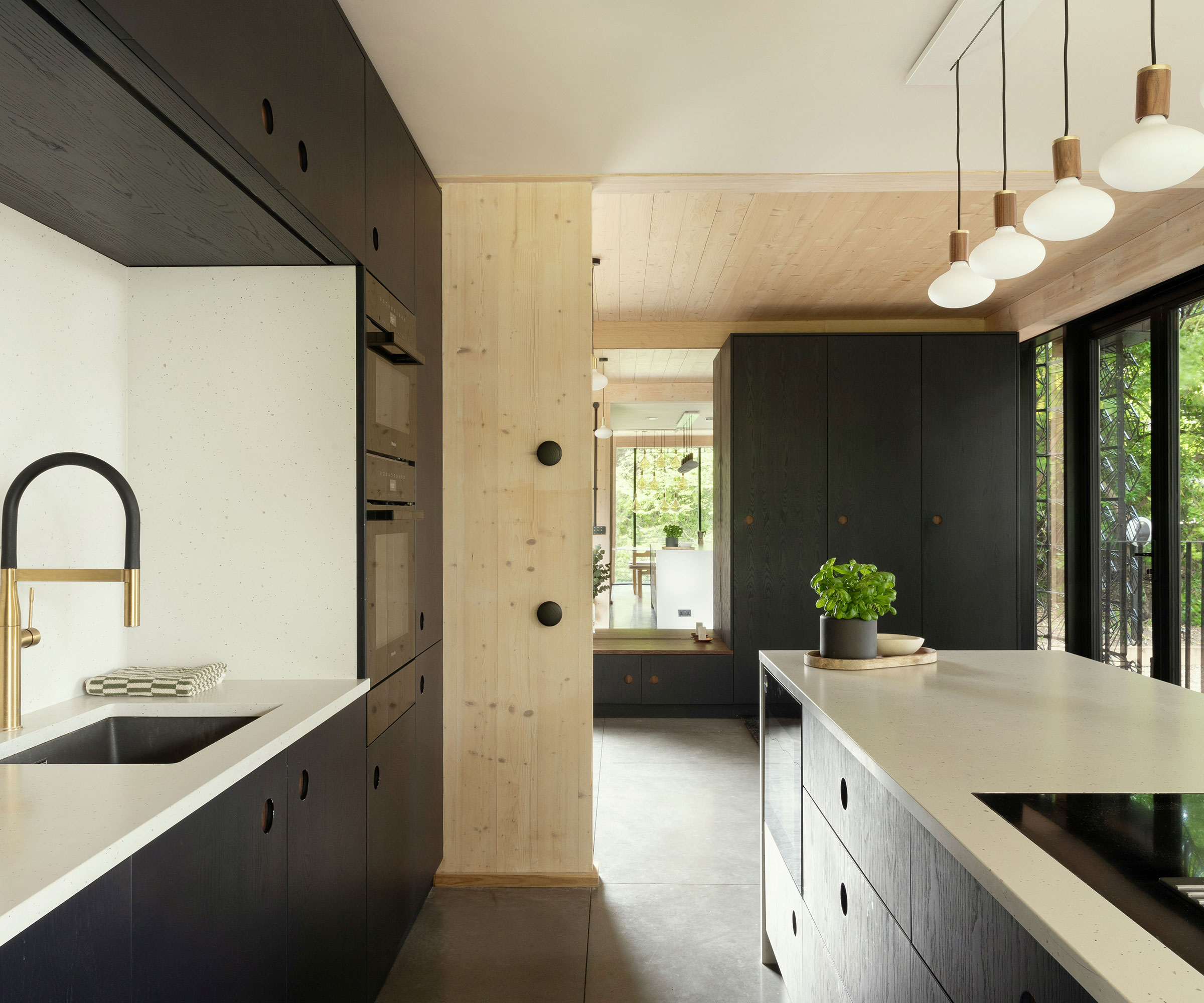 black modern kitchen with brass filter tap