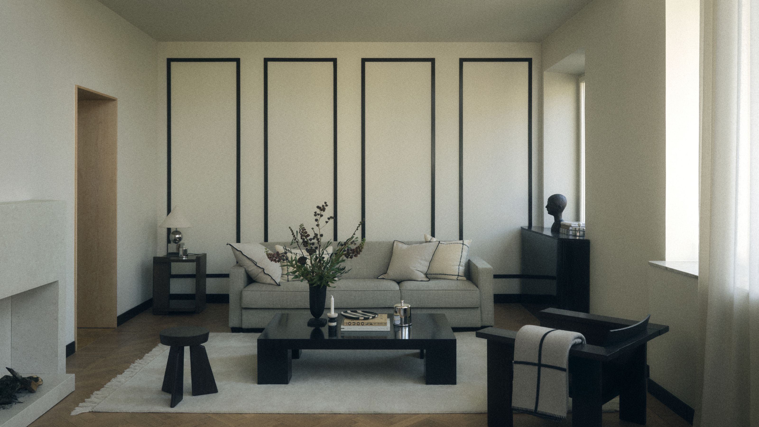 Modern grey living room with black finishes.