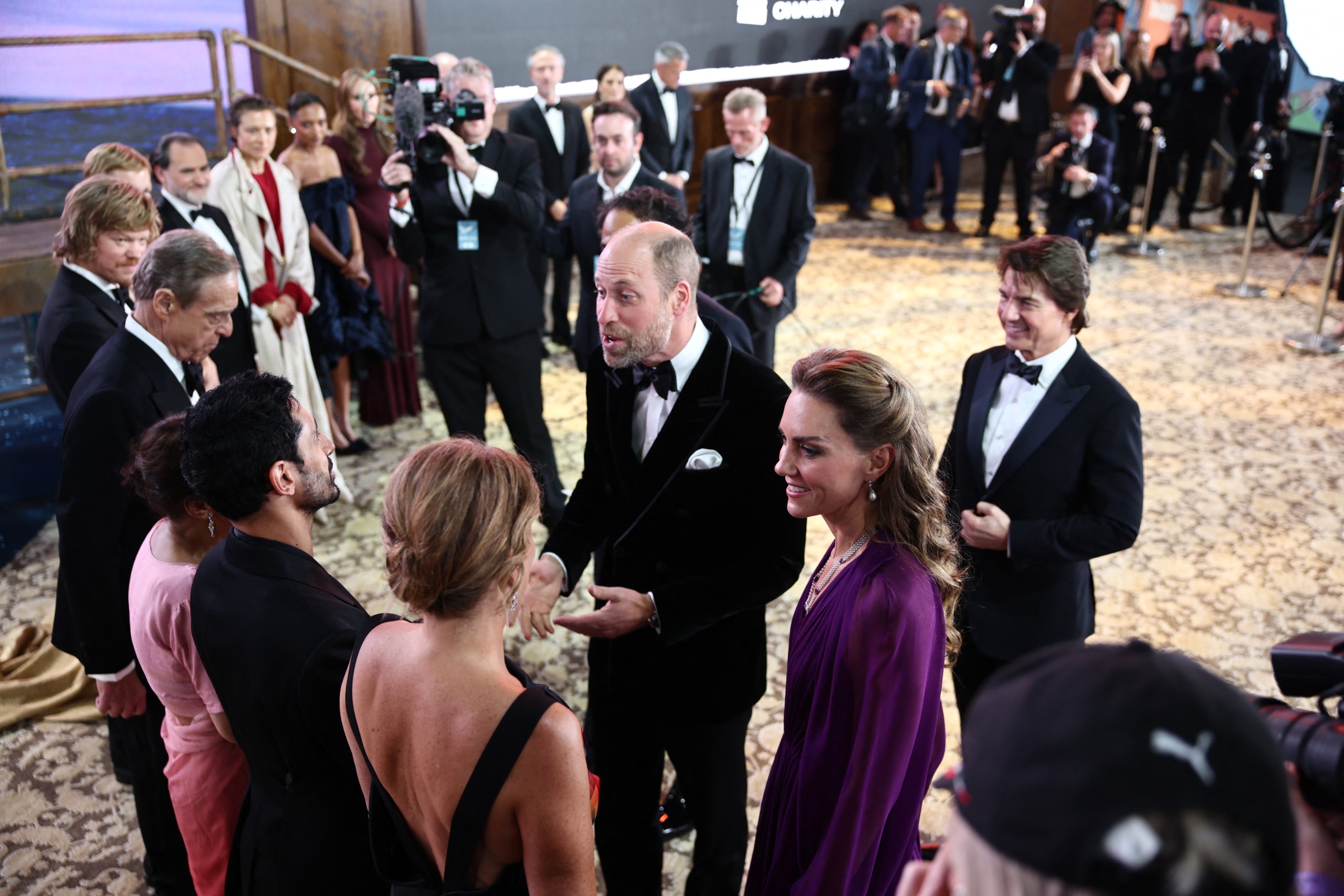 Prince William, Princess Kate and Tom Cruise talking to guests at the Digger premiere
