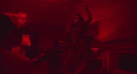 Beyonce swinging a lightbulb