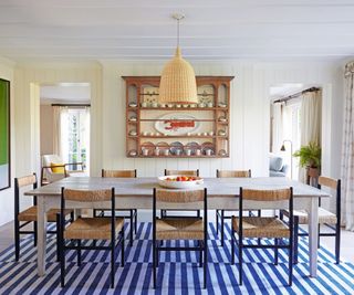 Blue and white stripped rug, wooden chairs