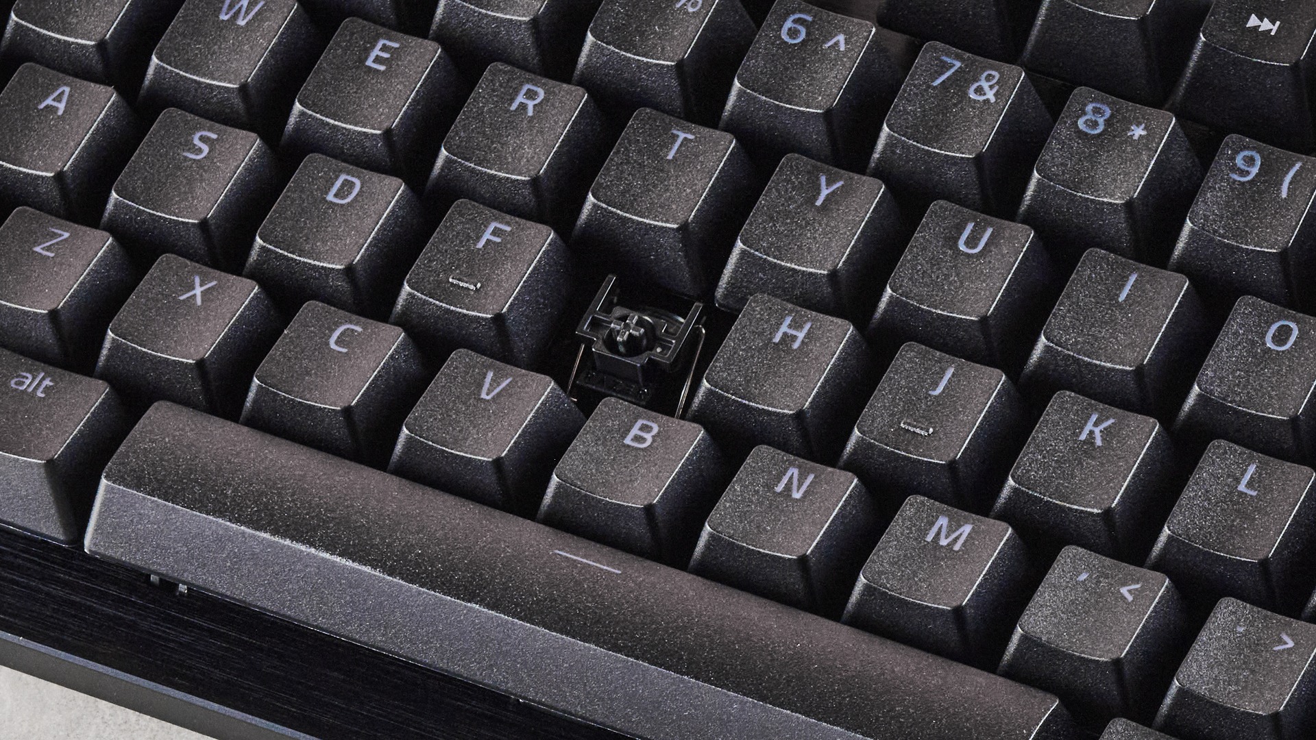 Close-up of switch underneath G key, with keycap removed, on the Razer Huntsman V3 Tenkeyless 8KHz