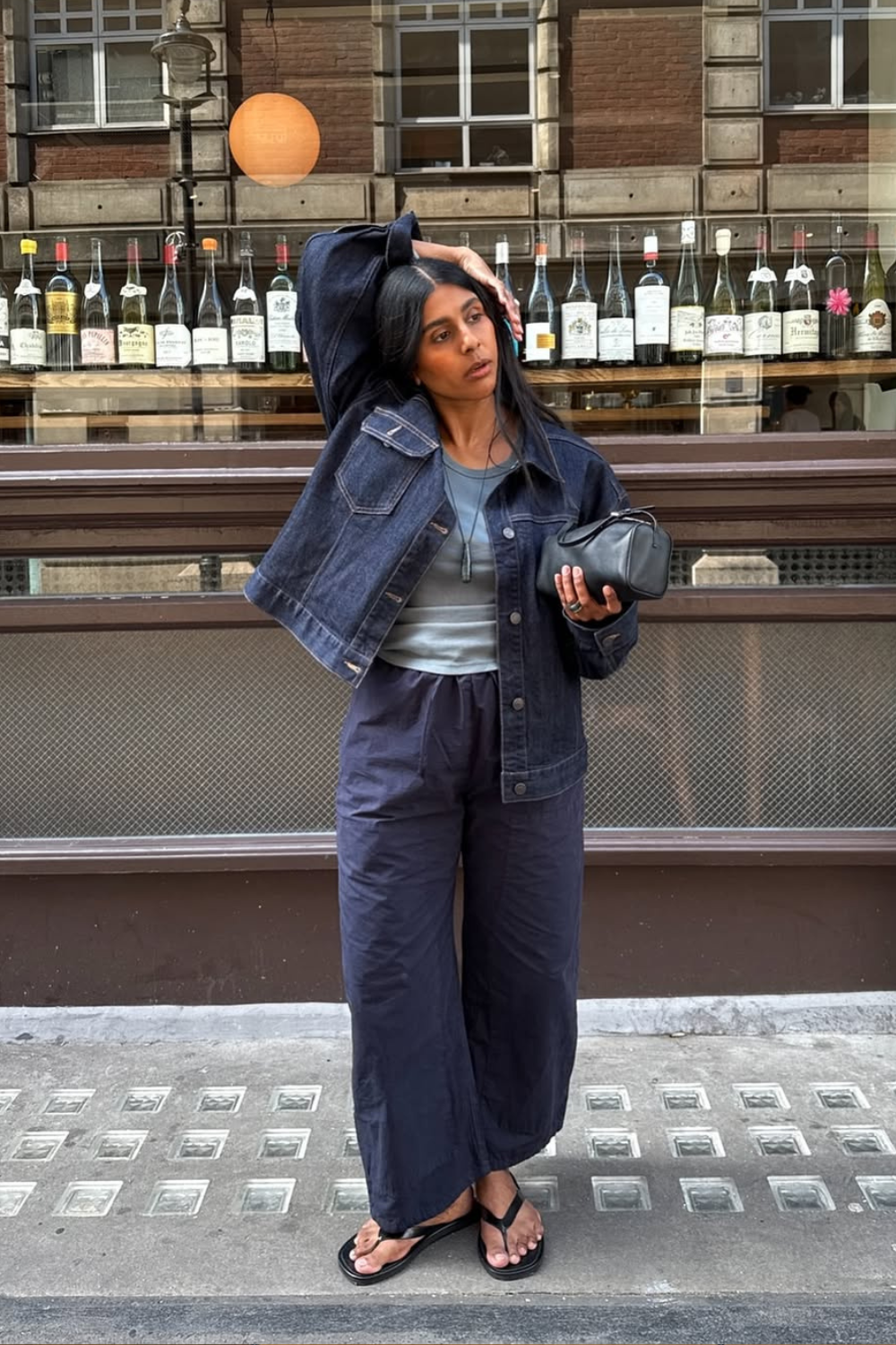 @monikh wears denim jacket, jeans and flip flops