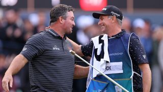 Ryan Fox and Dean Smith celebrate after Fox's win at the 2023 BMW PGA Championship
