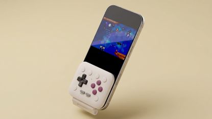 8BitDo FlipPad connected to a phone on a yellow background