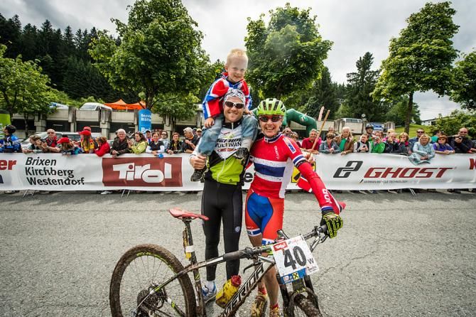 Newly crowned marathon world champion Gunn-Rita Dahle Flesjaa (Norway) poses with family