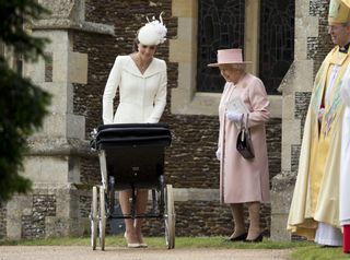 Catherine, Duchess of Cambridge, pushes her daughter, Princess Charlotte of Cambridge in a pram as Britain's Queen Elizabeth II and Archbishop of Canterbury Justin Welby