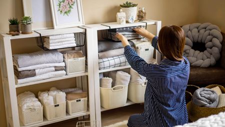 A woman organizing shelves