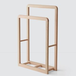 A light wooden standing rack for the best sustainable furniture brands.