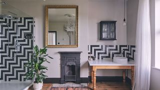bathroom renovation with original fireplace and wooden restored floor
