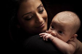 A mother with an infant baby. 