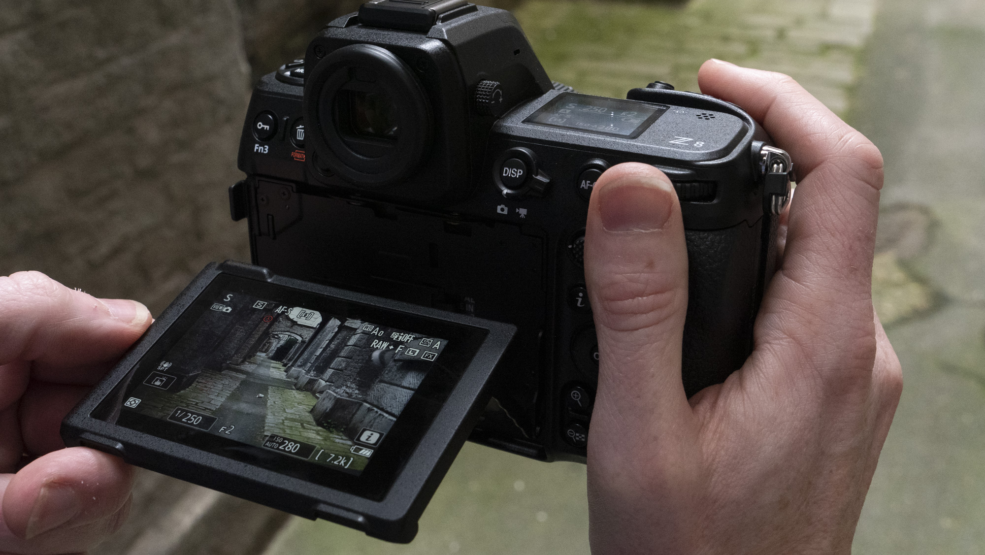 Nikon Z8 camera in the hand with screen pulled out