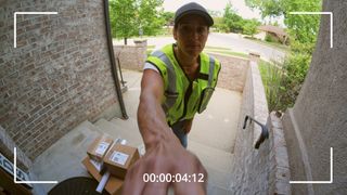 Delivery driver ringing video doorbell