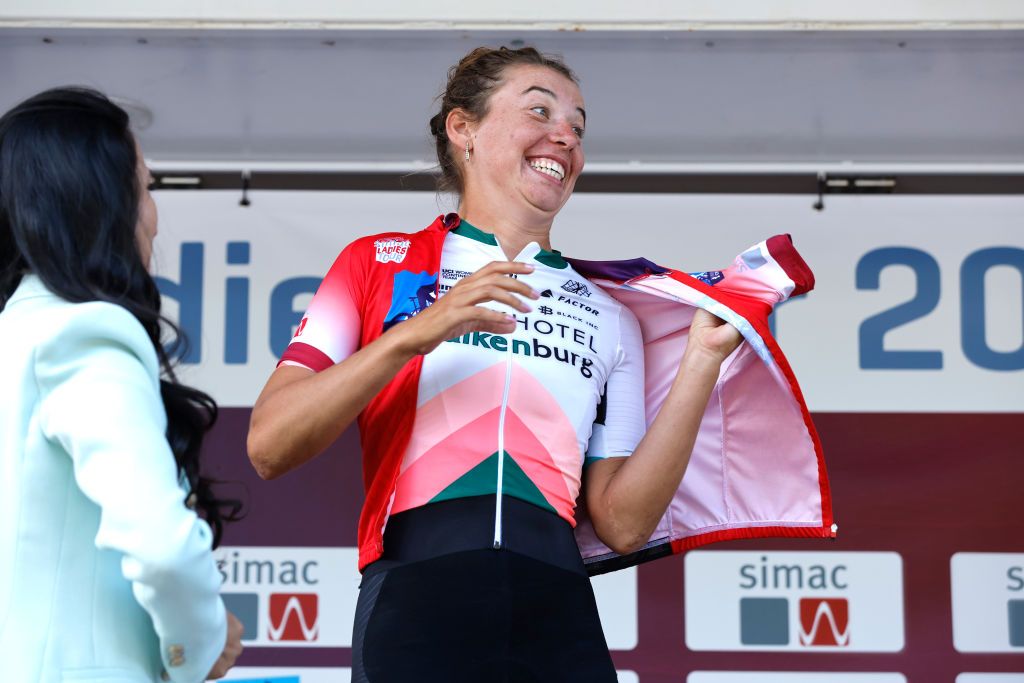 LANDGRAAF NETHERLANDS SEPTEMBER 02 Kirstie Van Haaften of Netherlands and Team Parkhotel Valkenburg celebrates at podium as red most combative rider jersey winner during the 25th Simac Ladies Tour 2022 Stage 4 a 1352km stage from Landgraaf to Landgraaf SLT2022 UCIWWT on September 02 2022 in Landgraaf Netherlands Photo by Bas CzerwinskiGetty Images