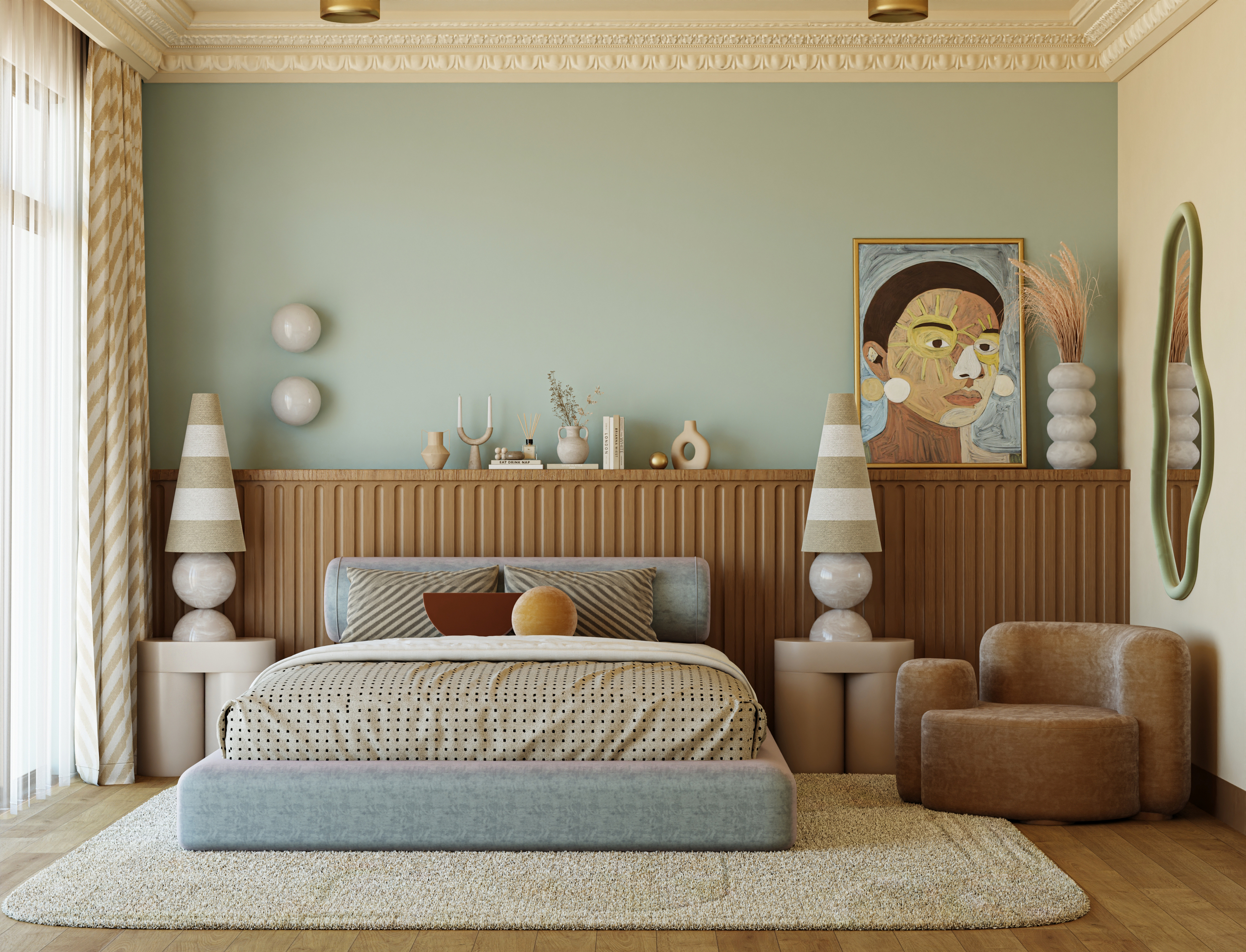 A bedroom with blue walls, a beige ceiling, a low bed, two large bedside tables and a mirror and armchair on the right