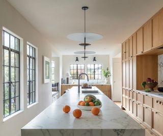 Wooden kitchen with marble island