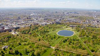 Kensington Gardens seen from above with London in the distance