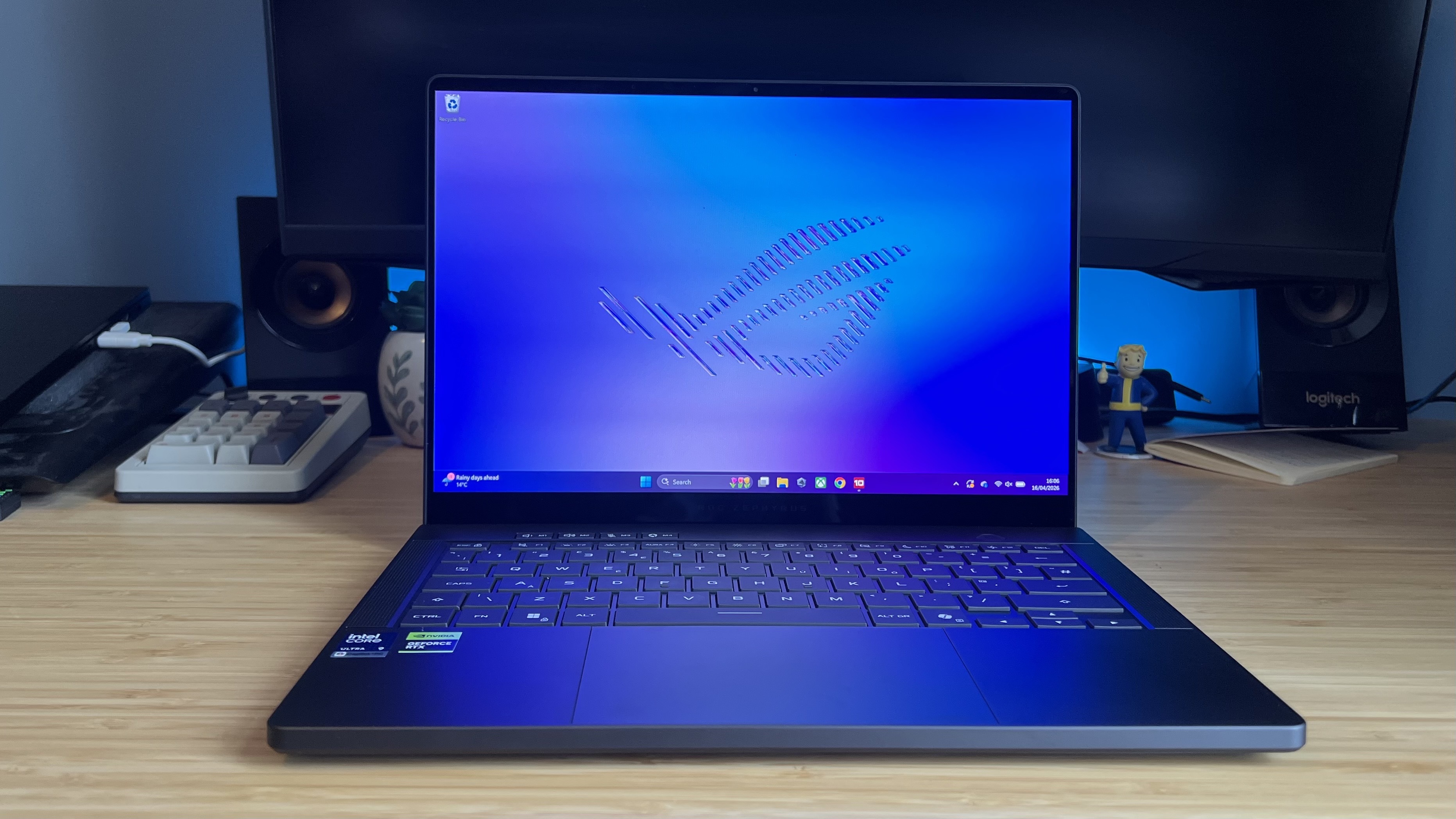 Asus ROG Zephyrus G14 2026 gaming laptop on a wooden desk