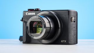 A black Canon PowerShot G7 X Mark III compact camera
