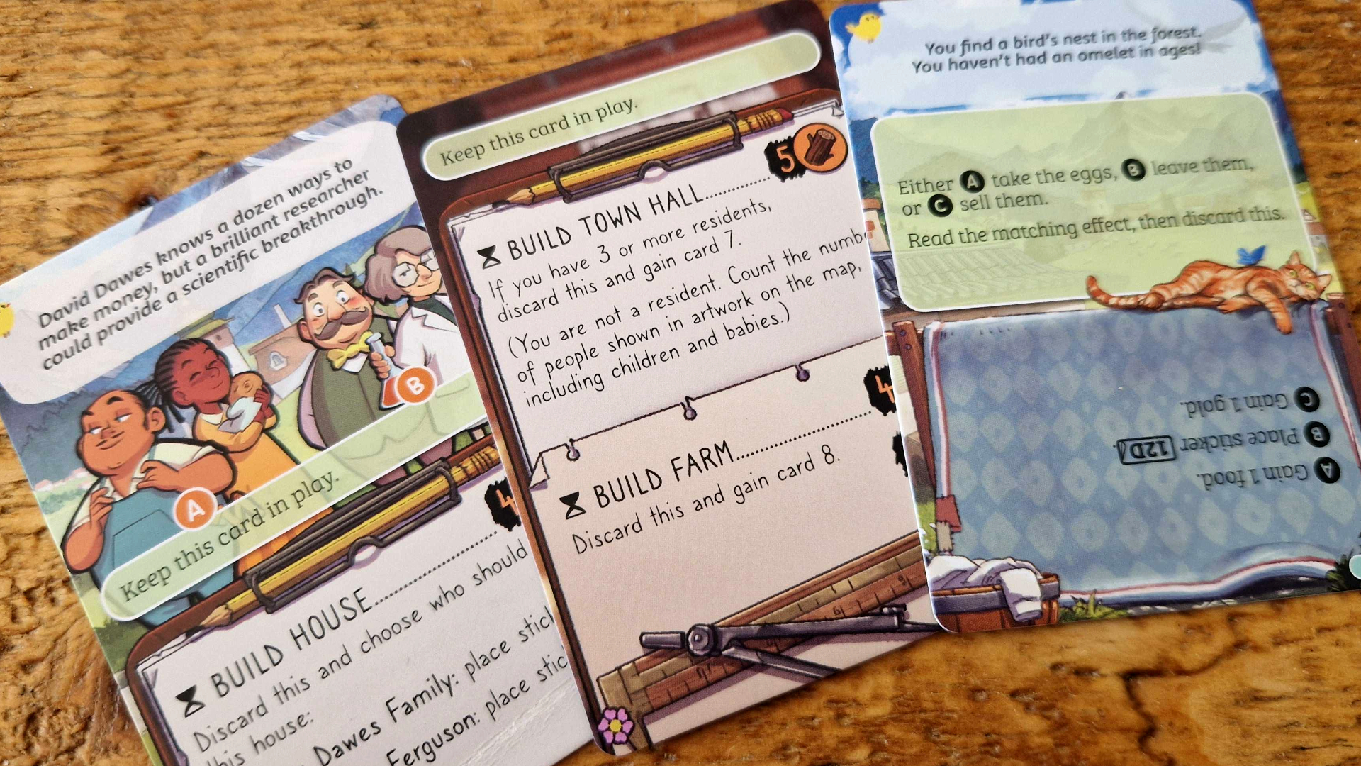 Cozy Stickerville components laid out on a wooden surface