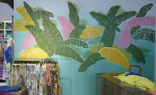 Tropical palm leaves on walls of Benetton store